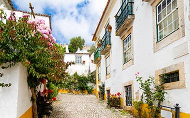 Traditional whitewashed buildings in the town of Óbidos, Portugal
